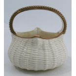 A Royal Worcester gilded ivory basket, with basket weave body and moulded handle, dated 1881, height