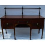 A 19th century mahogany bow front sideboard, with gilt metal rail to the back, fitted with three