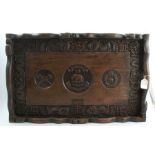 An Anglo Chinese Regimental carved hardwood tray, the centre carved with Assays 64 Pioneers