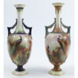 Two Royal Worcester pedestal vases, both decorated with peacocks in branches, one signed J Southall,