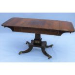 A 19th century rosewood sofa table, with drop flaps, satinwood inlay, fitted with one frieze drawer,