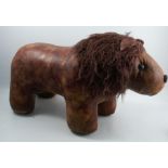 A leather lion, in the style of Liberty & Co, height 15.5ins