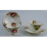 Two Royal Worcester cups and saucer, one decorated with yellow roses the other with pink roses,