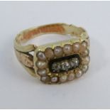 An early Victorian diamond and seed pearl mourning ring, the three silver collet set old cut