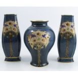 A garniture of Royal Worcester vases, to include a pair of rectangular baluster shaped vases and a