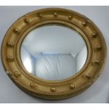 A Regency style convex wall mirror, of circular form, with gilt frame and ball decoration, overall