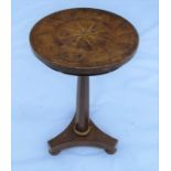 A 19th century oak occasional table, the circular top with star and triangular inlay, raised on an