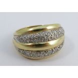 An 18 carat gold diamond set dress ring, the sixty two brilliant cuts set in two rows, finger size