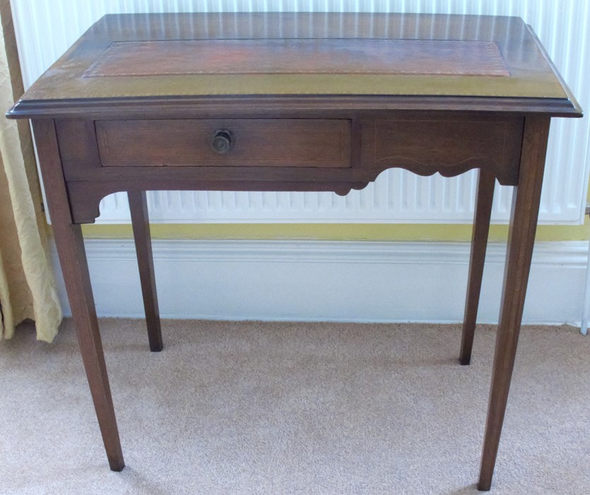 A mahogany side table, the top with inset tooled leather panel, fitted with a drawer to the