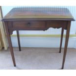 A mahogany side table, the top with inset tooled leather panel, fitted with a drawer to the