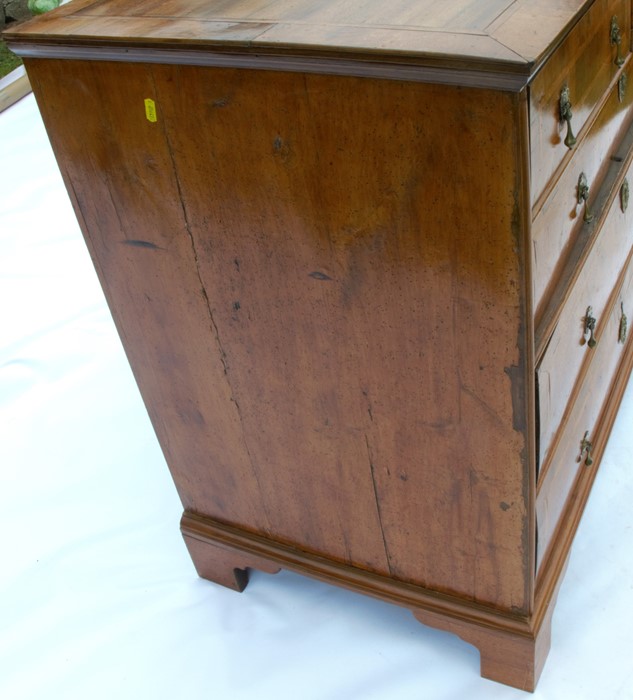 A 19th century walnut chest, fitted with two short over three long, graduated drawers with cross - Image 4 of 4