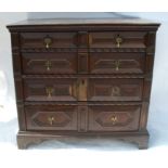An Antique oak moulded front chest of drawers, fitted with two short over three long drawers, raised