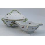 A Herend china covered tureen, decorated with birds, insects and foliage to a moulded ground,