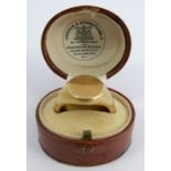 A plain signet ring, stamped '18', finger size P, 17.8g gross, cased