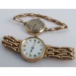 A lady's 9 carat gold mechanical wrist watch, on an expanding baton link bracelet, together with