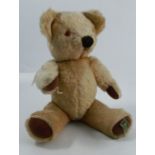A Merrythought gold plush teddy bear, made exclusively for Harrods, height 15.5ins
