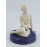 A Royal Worcester Crown Ware figure, of a seated semi naked female, decorated in parian with a