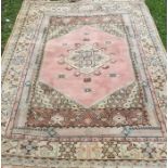 A Turkish wool rug, decorated with pastel colours, 84ins x 60ins