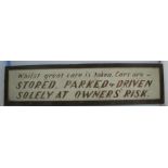 A painted wooden sign, Whilst great care is taken, Cars are stored, parked & driven solely at