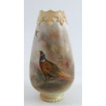 A Royal Worcester vase, decorated with a cock pheasant and a hen pheasant in flight by Jas