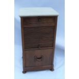 A 19th century mahogany and marble top bedside cabinet, fitted with a drawer, over a tambour front