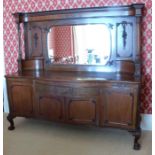 A late 19th century mahogany mirror back sideboard, with bow front, the mirror back with carved