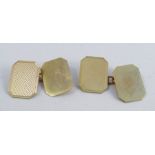 A pair of 9 carat gold cufflinks, the rectangular cut corner panels, one plain, one engine turned,