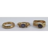 A 9 carat gold single stone sapphire dress ring, together with another similar and a 9 carat gold