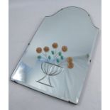 A 20th century wall mirror, with arched top and decorated with applied coloured glass flowers and