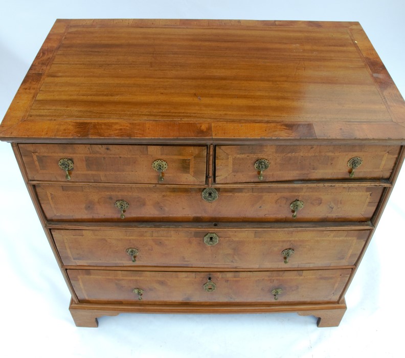 A 19th century walnut chest, fitted with two short over three long, graduated drawers with cross - Image 2 of 4