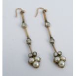 A pair of Edwardian diamond and split pearl drop earrings, the three section knife edge suspension