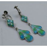 A pair of silver and enamel drop earrings, decorated in blues and greens, with screw fittings