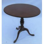 A 19th century mahogany tilt top occasional table, raised on a turned baluster column, to three