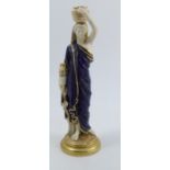 A Royal Worcester model, of a Grecian water carrier, decorated in a mottles blue and gilt to a