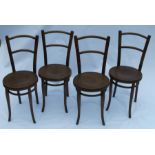 A set of four Thonet bentwood chairs, with floral decorated seats, paper labels to underside