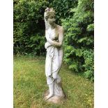 A garden statue, of a naked female figure draped with cloth, height 46.5ins