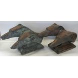 A pair of bronze effect post finials, formed as a pair of greyhound busts, on stepped bases,