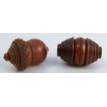 Two Victorian treen nutmeg graters, one formed as an acorn, the other being a coquilla nut, both