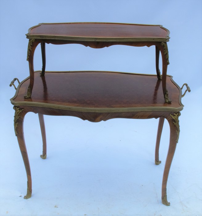 A 19th century kingwood two tier table, with parquetry inlay and gilt metal mounts, the larger table