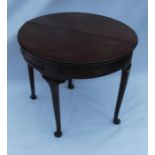 A mahogany D shaped table, with fall flap and swing leg, fitted with two frieze drawers, raised on