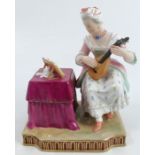 A 19th century Vienna porcelain figure, representing Hearing, dated 1852, the lady playing a guitar,