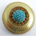 A Victorian gold brooch, unmarked, turquoise domed cluster centre within an applied wire workmount,