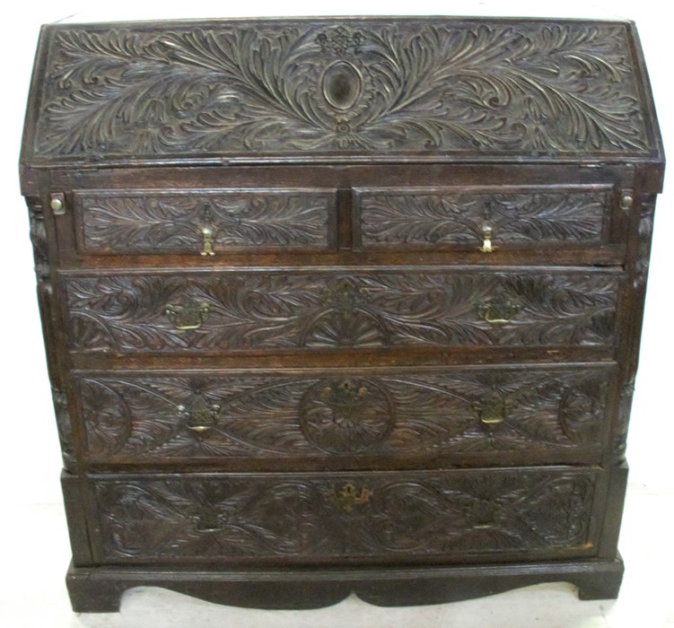 An Antique dark oak carved bureau, the fall flap opening to reveal drawers, cupboard and pigeon - Image 3 of 4