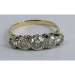A five stone diamond ring, unmarked, the graduated transitional brilliant cuts totalling