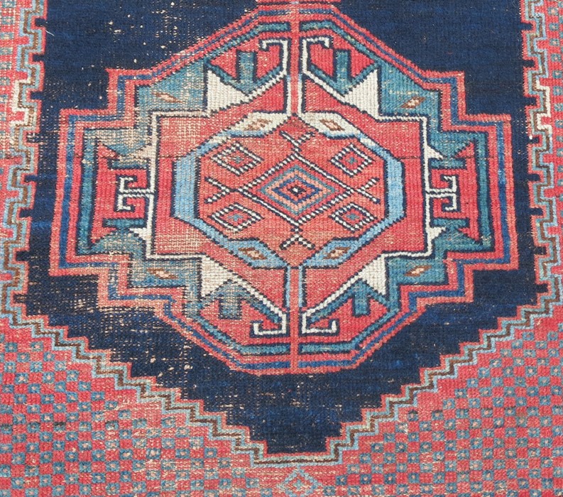 An Eastern design rug, the field with three motifs to a dark blue ground, 73ins x 48ins - Image 2 of 3