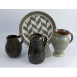 A collection of 20th century pottery, to include a jug possibly by Bernard Leach, height 7.5ins, a