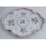 An 18th century Meissen rococo tray, of shaped oval form, decorated with flowers and having and