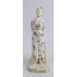 A 19th century Royal Worcester figure, in the Hadley style of a woman in a floral dress, height 7.