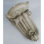 A 19th century cast and painted c-scroll shaped plaster wall bracket