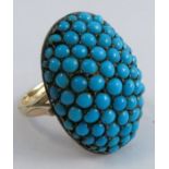 A domed oval turquoise cluster ring, unmarked, finger size P, 5.8g grossCondition Report: Some